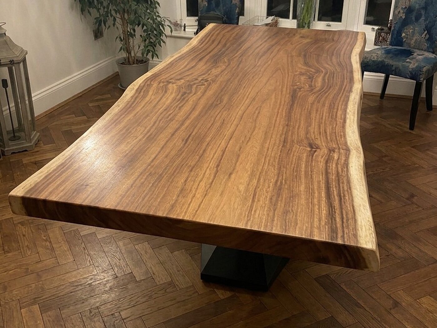 The top seen down its length, both live edges pale against the honey heartwood